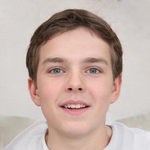 Joyful white child male with short  brown hair and grey eyes