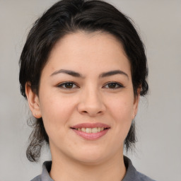 Joyful asian young-adult female with medium  brown hair and brown eyes