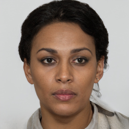 Neutral latino young-adult female with short  black hair and brown eyes