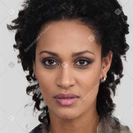 Joyful black young-adult female with long  brown hair and brown eyes