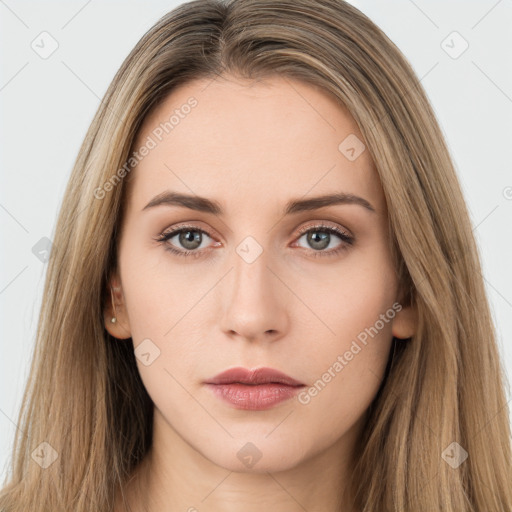 Neutral white young-adult female with long  brown hair and brown eyes