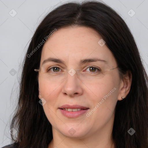 Joyful white adult female with long  brown hair and brown eyes