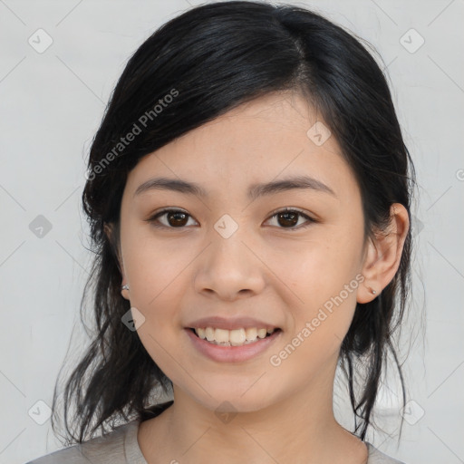 Joyful asian young-adult female with medium  black hair and brown eyes