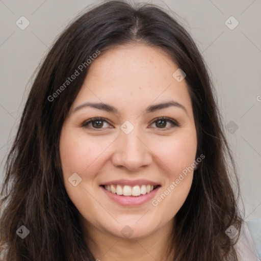 Joyful white young-adult female with long  brown hair and brown eyes