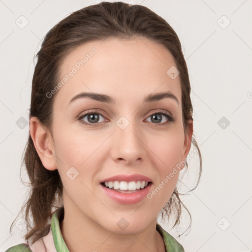 Joyful white young-adult female with medium  brown hair and green eyes