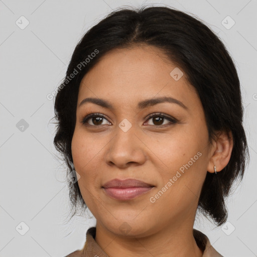 Joyful latino young-adult female with medium  brown hair and brown eyes