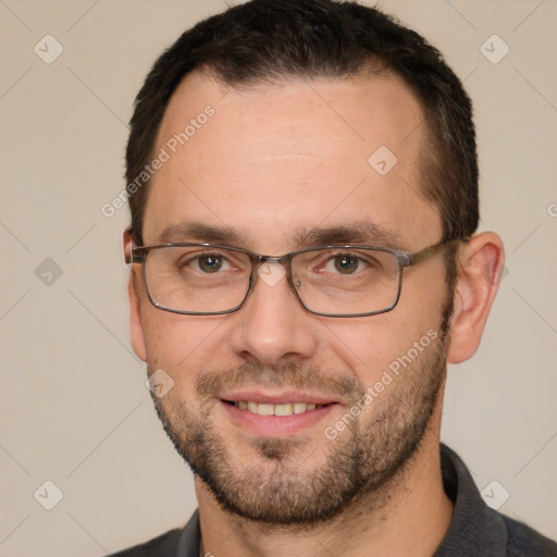 Joyful white adult male with short  brown hair and brown eyes