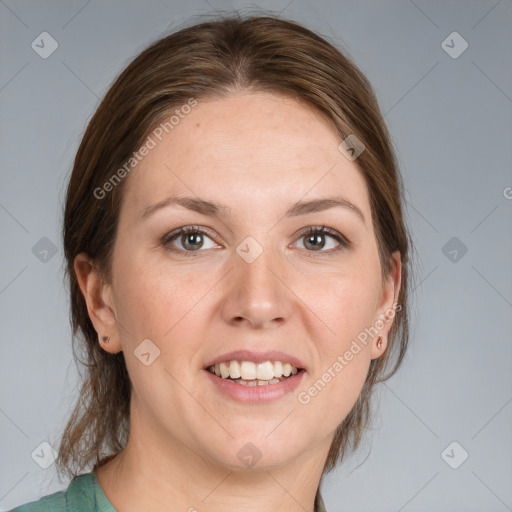 Joyful white adult female with medium  brown hair and grey eyes