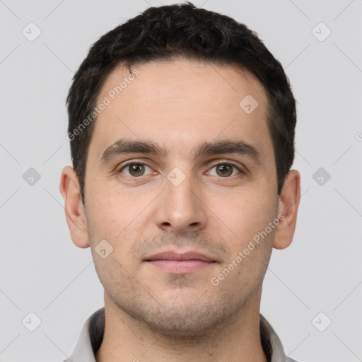 Neutral white young-adult male with short  black hair and brown eyes