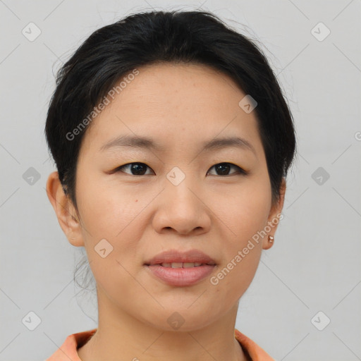 Joyful asian young-adult female with short  brown hair and brown eyes