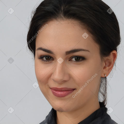 Joyful latino young-adult female with medium  brown hair and brown eyes