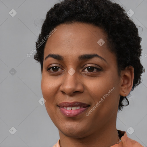 Joyful latino young-adult female with short  brown hair and brown eyes