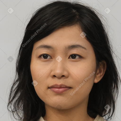 Joyful asian young-adult female with long  brown hair and brown eyes