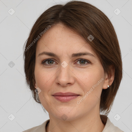 Joyful white adult female with medium  brown hair and grey eyes