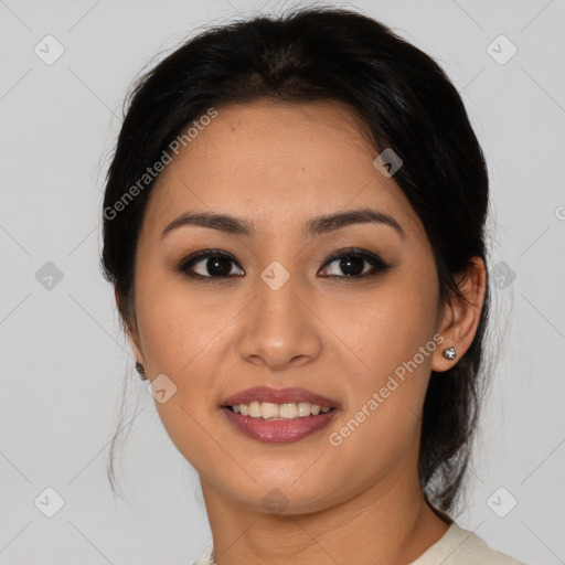 Joyful asian young-adult female with medium  brown hair and brown eyes