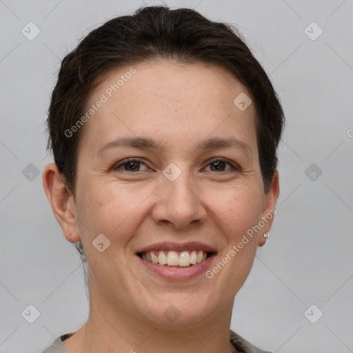 Joyful white adult female with short  brown hair and brown eyes