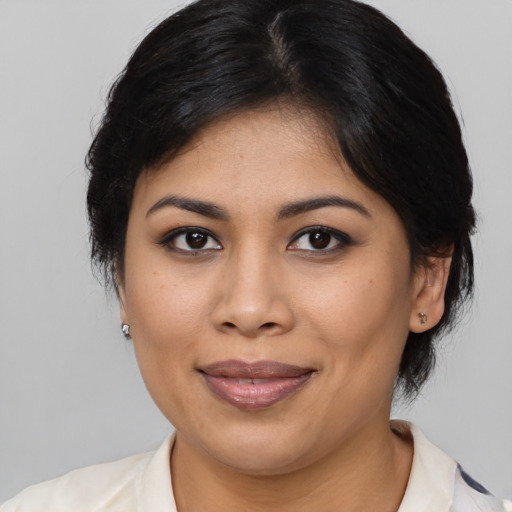 Joyful asian young-adult female with medium  brown hair and brown eyes