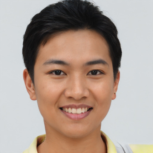 Joyful asian young-adult female with short  black hair and brown eyes