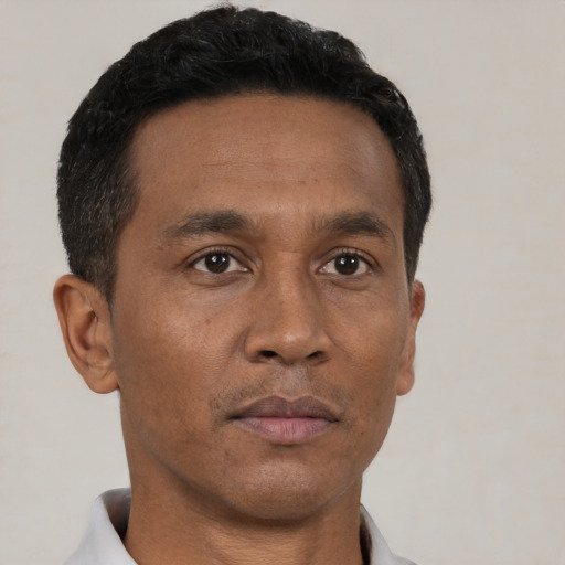 Neutral black adult male with short  black hair and brown eyes