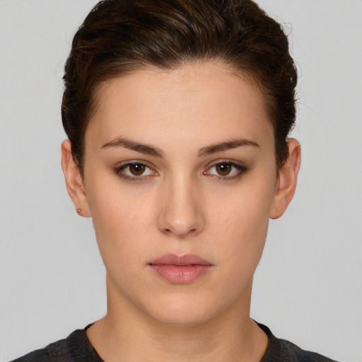 Neutral white young-adult female with short  brown hair and brown eyes