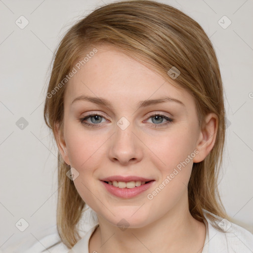 Joyful white young-adult female with medium  brown hair and blue eyes