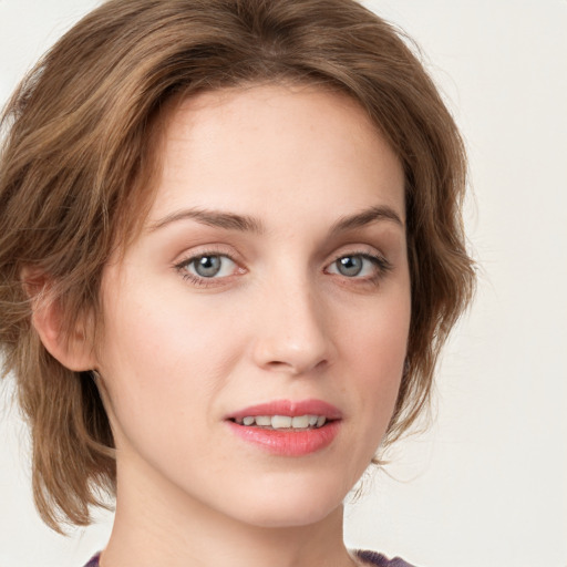 Joyful white young-adult female with medium  brown hair and green eyes