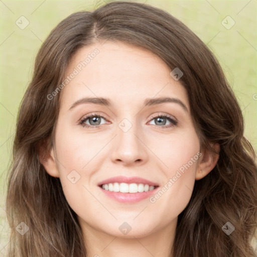 Joyful white young-adult female with long  brown hair and green eyes