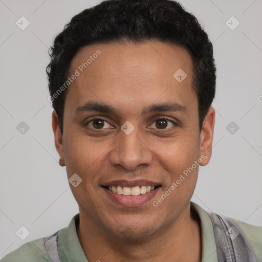 Joyful latino young-adult male with short  brown hair and brown eyes