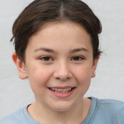 Joyful white child female with short  brown hair and brown eyes