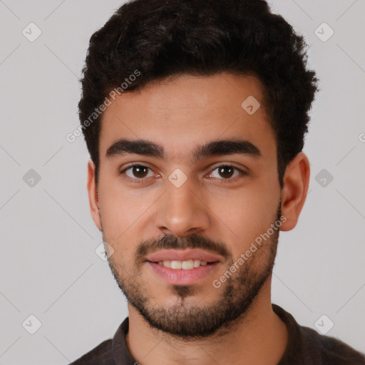 Joyful white young-adult male with short  black hair and brown eyes