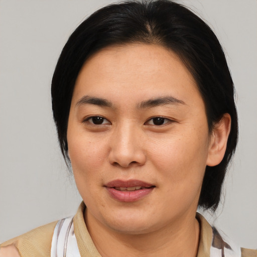 Joyful white young-adult female with medium  brown hair and brown eyes