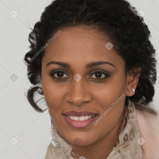 Joyful black young-adult female with long  brown hair and brown eyes