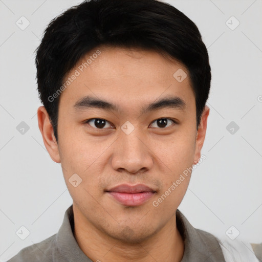 Joyful asian young-adult male with short  black hair and brown eyes