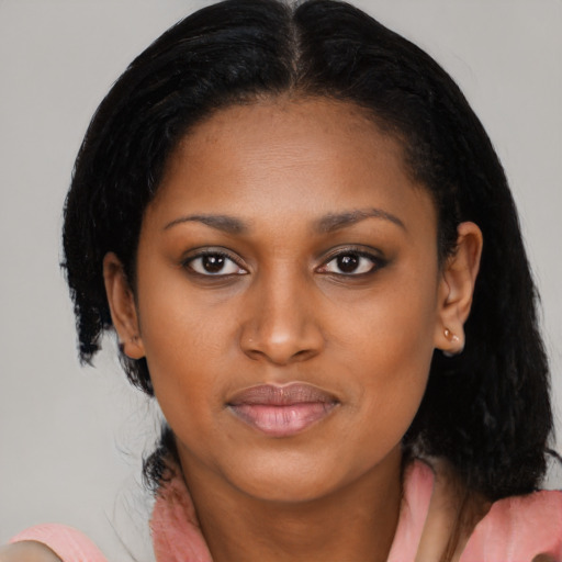 Joyful latino young-adult female with medium  black hair and brown eyes