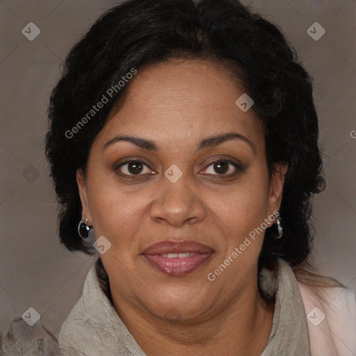 Joyful black adult female with long  brown hair and brown eyes