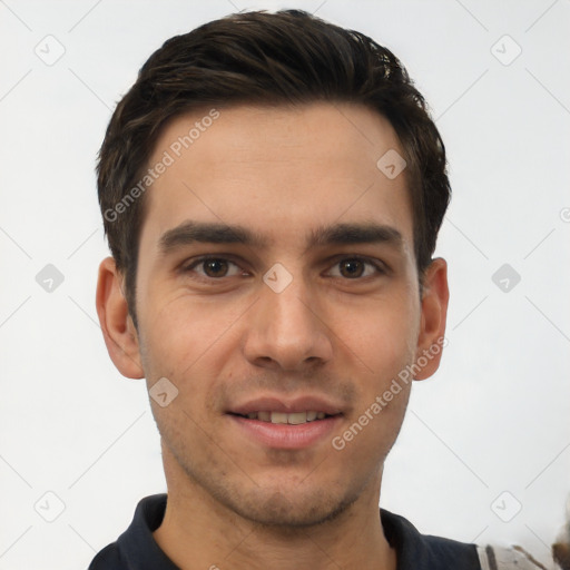 Joyful white young-adult male with short  black hair and brown eyes