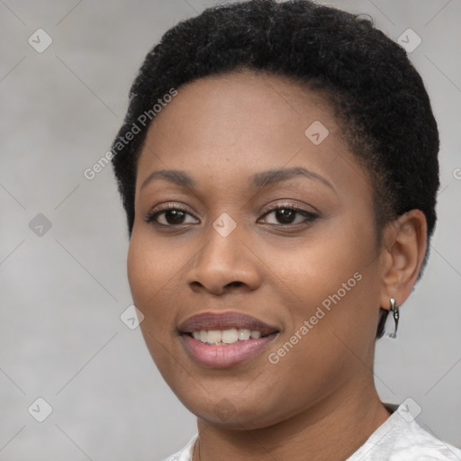 Joyful black young-adult female with short  brown hair and brown eyes