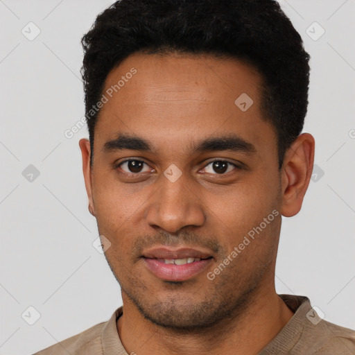 Joyful latino young-adult male with short  black hair and brown eyes