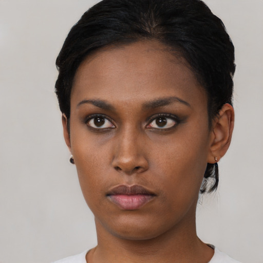 Neutral black young-adult female with short  black hair and brown eyes