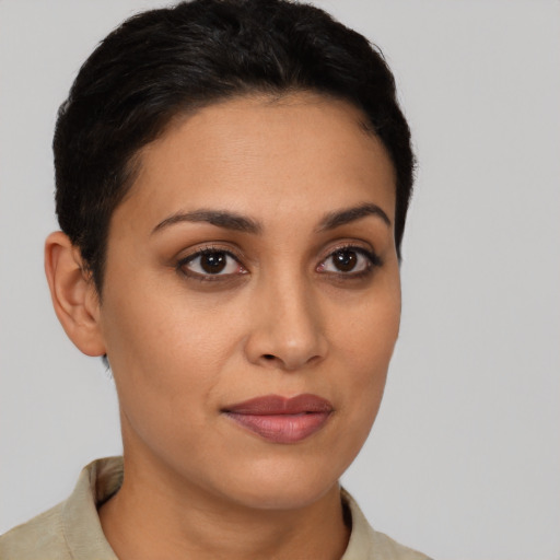 Joyful latino young-adult female with short  brown hair and brown eyes