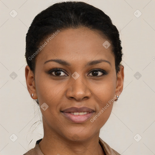 Joyful black young-adult female with short  black hair and brown eyes