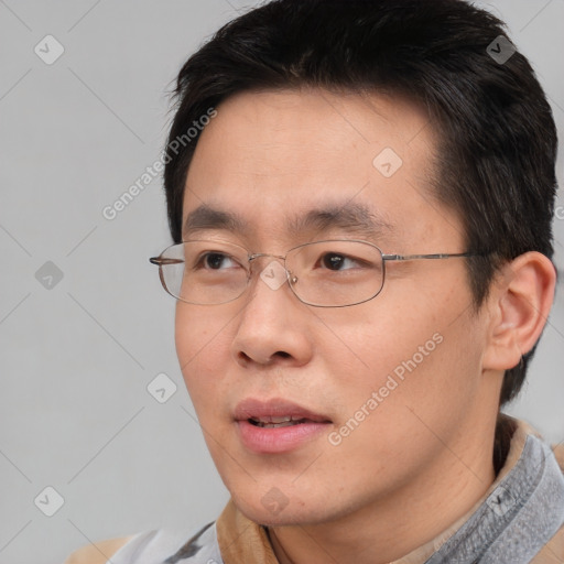 Neutral asian young-adult male with short  brown hair and brown eyes