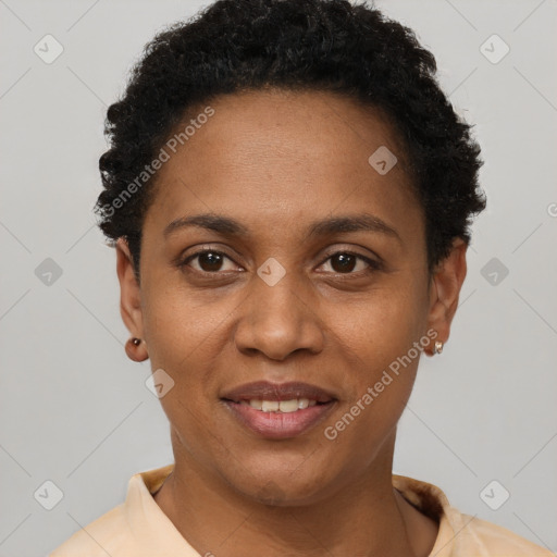 Joyful black young-adult female with short  black hair and brown eyes