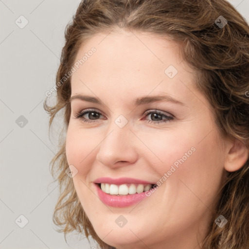 Joyful white young-adult female with medium  brown hair and green eyes