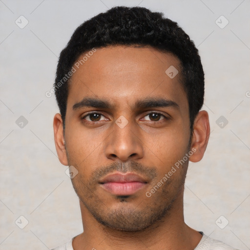 Neutral latino young-adult male with short  black hair and brown eyes