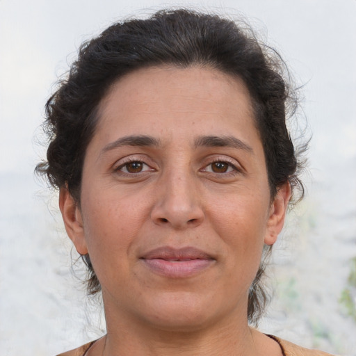 Joyful asian adult female with short  brown hair and brown eyes