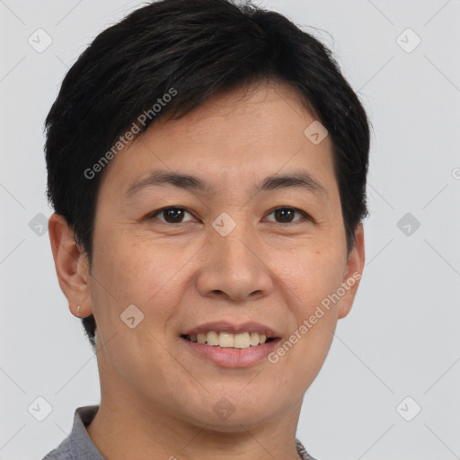 Joyful asian young-adult male with short  brown hair and brown eyes