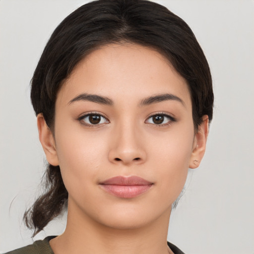 Joyful white young-adult female with medium  black hair and brown eyes