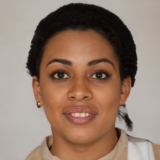 Joyful latino young-adult female with short  brown hair and brown eyes