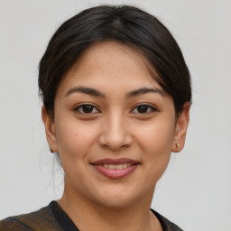 Joyful asian young-adult female with short  brown hair and brown eyes